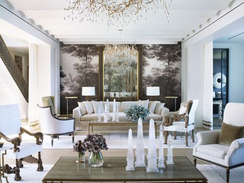 elizabeth and stanley star's home in naples, florida designed by bobby mcalpine and susan ferrier a tropical grisaille mural ananbô headlines the living room sofa, promemoria